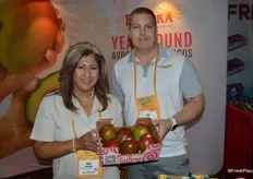Mary Velasquez and Tom Hall with Freska Produce showing a 6 lb. box of mangos that comes in conventional as well as organic.