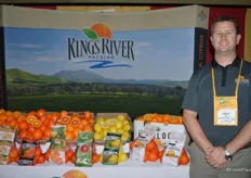 Andrew Horn with Kingsburg Orchards next to a beautiful selection of California citrus.