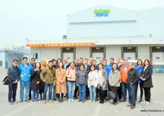 Group photo in front of the Exfresh logistics hub and cold storage facilities.