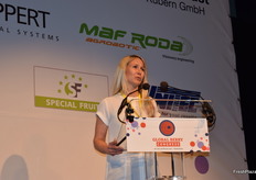 Anja Grueterich from Ekland Marketing Co., unveiling their new management structure at the Global Berry Congress. Patrick Ballew assumes the role of CEO while Rodrigo Ocampo has been named chief financial officer. Ballew’s wife, Gabriela Pavia, joins as a member of the board of directors.