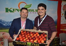 Jose Herrera with Kingsburg Orchards and Adnan Awnallah with Cali Fresh Produce proudly show California's first harvest of stone fruit for this season.
