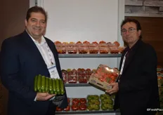 Dino Dilaudo and Tony Cappelli with Westmoreland- TopLine Farms. Dino shows a new club pack of mini cucumbers. Tony shows a pack of 4 lbs. organic Tomatoes on the Vine, a new product as well.