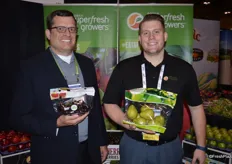 Mike Preacher and Ryan Cleary with Superfresh Growers. Mike shows a pouch bag with organic dark sweet cherries and Ryan holds a 3 lbs. pouch bag of D’Anjou pears.