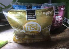 As a premium fresh packer from Calgary, Alta. displayed its potatoes in a new look—single color see- through bags, each of which feature its own variety of potato.