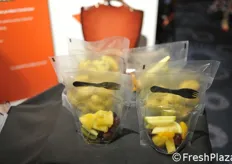Fruit to go, small bags with fruit salads and fork.