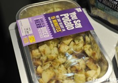 Baking trays with potatoes ready to cook.