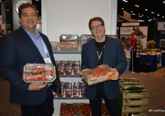 Dino Dilaudo and Matt Wright with Westmoreland-TopLine Farms show organic tomatoes on the vine in different packaging options.
