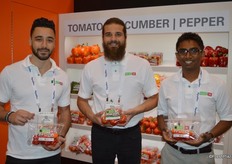 Nick Hanna, Mitch Amicone and Kurvin Soobrayen with Amco Produce. Nick and Kurvin show a hot pepper pack with different colors of Habanero peppers. The product is sold under the brand name Inferno. Mitch shows organic tomatoes on the vine.