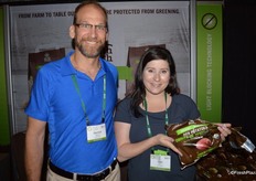 Derrick Rayner and Lisa Kacur with Earth Fresh Foods. Lisa shows a 3 lbs. light-blocking bag with organic red potatoes. The company finished a re-brand of its organic line 9 months ago.