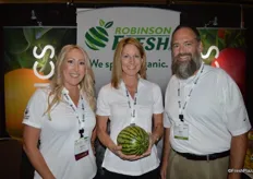 Jamie Sgheiza, Lara Grossman and John Pursel with Robinson Fresh show an organic mini watermelon as the watermelon season is coming up. The company's organic division is called Tomorrow's Organics.