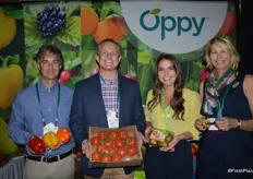 A colorful Oppy booth with organic bell peppers, tomatoes on the vine and SunGold kiwifruit. From left to right: Chris Ford, Jim Leach, Laura Sterling and Karen Caruso.