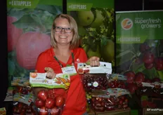 Catherine Gipe-Stewart with Domex Superfresh Growers shows organic Autumn Glory apples as well as organic sweet cherries.
