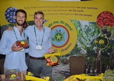 Pablo Bouquet and Brandon Rankin with Taste Me, do Good proudly show organic strawberries and organic apples.