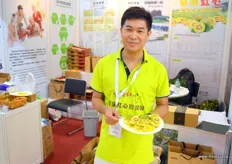 Hai Jian Li presents his company's red hearted and green Chinese kiwifruit at Sichuan Huapu Modern Agriculture. Sichuan province is a large producing region of Chinese kiwifruit.
