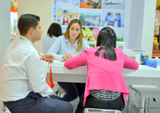 Discussions at Yidu's stand.