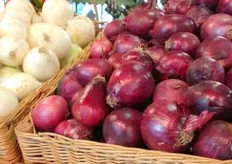 Red and white onions are presented in a basket too.