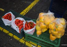 Chili and yellow bell peppers for sale.