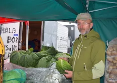 Maciej Kmera from Bronisze holds one of the loose cabbage leafs which are used to make traditional cabbage rolls filled with meat.