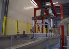 The first machine in the apple processing line after harvest to prepare and clean apples for sorting.