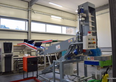 Machine to gently put apples in cartons.