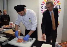 A chef cutting up pieces of a Kissabel apple for visitors of the press conference to taste. The European launch of the three pink to red-fleshed apples, was announced at the event.
