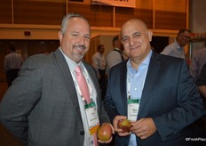 Chris Ciruli and Mark Cassius with Ciruli Brothers, showing mangos.