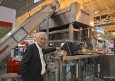 Willem de Jong showing a pouch bag machine from Volm Companies that can package 35 bags per minute.