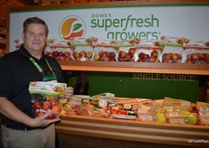 David Roby with Domex Superfresh Growers proudly shows the company's new harvest of Autumn Glory apples.