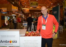 Chris Pollock with BC Tree Fruits proudly shows Ambrosia apples and talked about the re-brand of Ambrosia apples for the US market. The bin shows the re-designed logo.