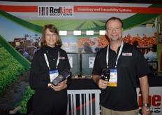 Carol Golsch and Adrian Down with RedLine Solutions. Carol shows the MC9200 scanner with Windows CE software while Adrian shows the TC8000, supported by Android software.