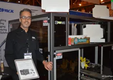 Anthony Del Viscio with Eagle Packing proudly shows a machine to pack boxes of produce
