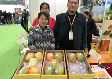 Tina Y.L. Yeung, CEO at Hong Kong Golden Sunflower, an import company, is visiting her panzihua mango suppliers at the stand of MeiGuoBao. To the right is Bai Bing, General Manager.