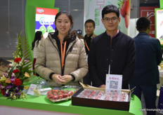To the left is Chao Tong of Cat Fresh Fruit. The strawberries are grown in greenhouses and available all year around.