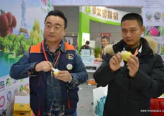 Hainan's agricultural products are represented by a group of growers from the island, including Lin Bo and Ma Fulai from Hainan Province Farmers Agricultural Development.