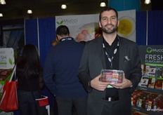 Stephen Cowan with Mucci shows a clamshell of Smuccies. The company recently announced expansion of its greenhouse strawberry acreage.