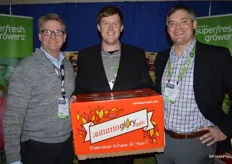 Dan Harrington, Tyler Weinbender and Jason Fonfara with Domex Superfresh Growers. Tyler proudly shows a box of Autumn Glory apples.