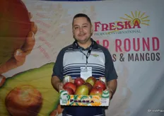 Jose Juan Rodriguez with Freska Produce. Jose shows mangos from Ecuador. Peruvian mangos will arrive in two weeks.