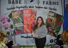 Rosie Munoz with Babe Farms proudly shows the company's finalist innovation award.
