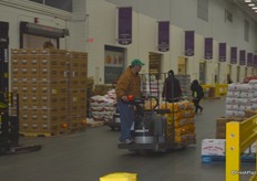 Lots of activity in the market as the group tours from one merchant to the next.