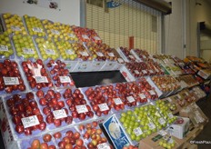Apples on display are all wrapped in plastic