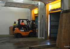 Pallets are loaded into truck.