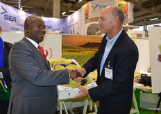 Willem Bestbier, SATI CEO handing over the box of Joybells to Jacob Moatshe, the Economic Counsellor at the South African Embassy in Berlin.