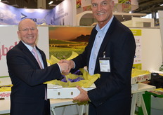 Willem Bestbier, SATI CEO handing over the box of Joybells to the Messe Berlin representative Gérald Lamusse.