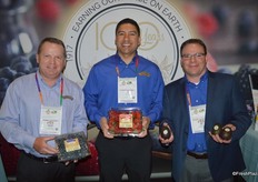 Archie Taylor, Jerry Moran and Joe Dugo with Naturipe proudly show blueberries, Florida strawberries and avocados.