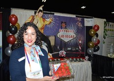 Leslie Simmons with Dave's Specialty Imports shows strawberries from the company's own farm in Florida.