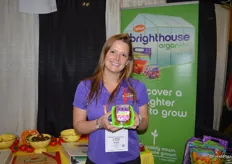 Grape tomatoes are now available from NatureSweet's Brighthouse Organics line. Olivia Storvik proudly shows the new product.