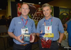 Brian Busey and Tom Fleming with Yakima Fresh show strawberry cherries that have a light flesh and the rougher skin of a strawberry.