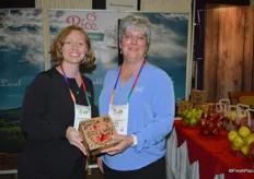 Maggie Travis and Brenda Briggs with Rice Fruit Company show the company's new snack pack that includes four apples.