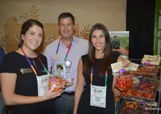 Paige Stewart, Steve Poklemba and Krysten DeGiglio with Village Farms show a clam shell of Lorabella blossom tomatoes as well as a pouch bag with heavenly villagio marzano tomatoes.