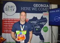 Ken Paglione with Pure Flavor. The company is going through a re-brand with the result shown on the pouch bag with mini peppers. The company is currently building a high-tech greenhouse in Georgia as can be seen on the backdrop.
